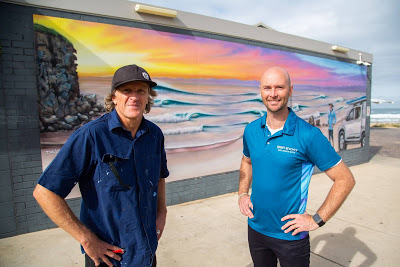 Artist Daniel Joyce and Smart Beaches Project Manager Tony Blunden with the main mural
