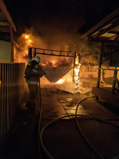 Firefighters battle the flames at the Glebe Road property Picture: Merewether Fire & Rescue