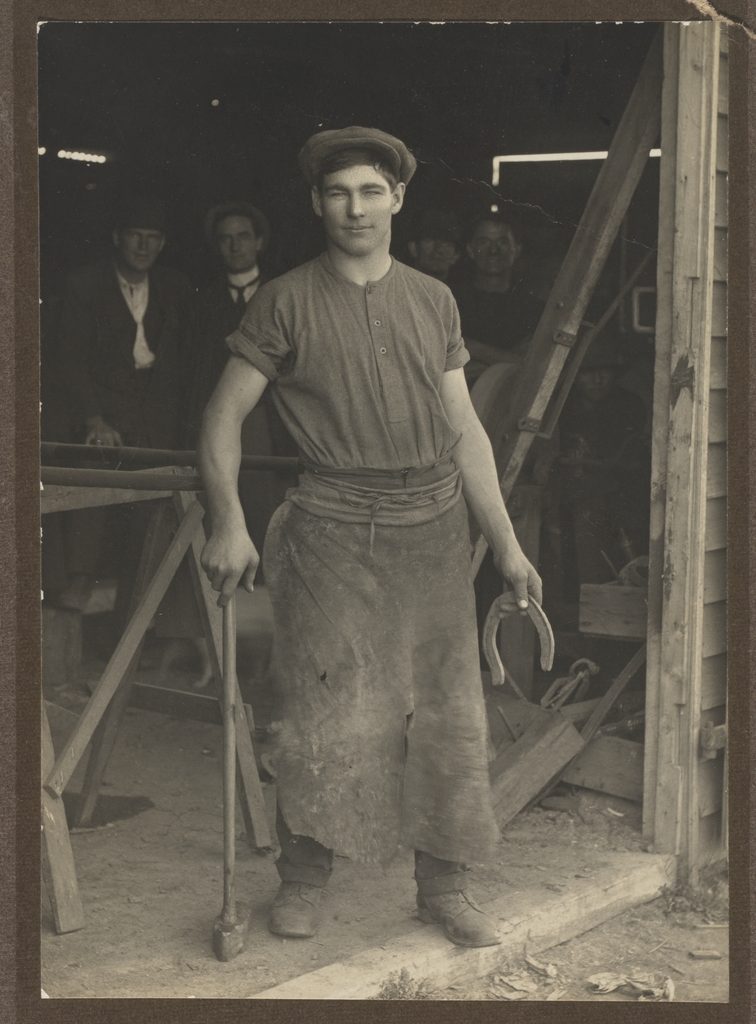 Les Darcy at the blacksmith shop door